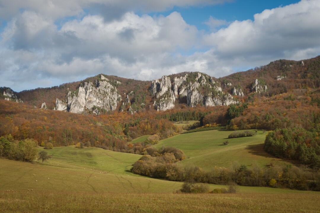 Historic Slovak castle ruins on a hill under blue sky
