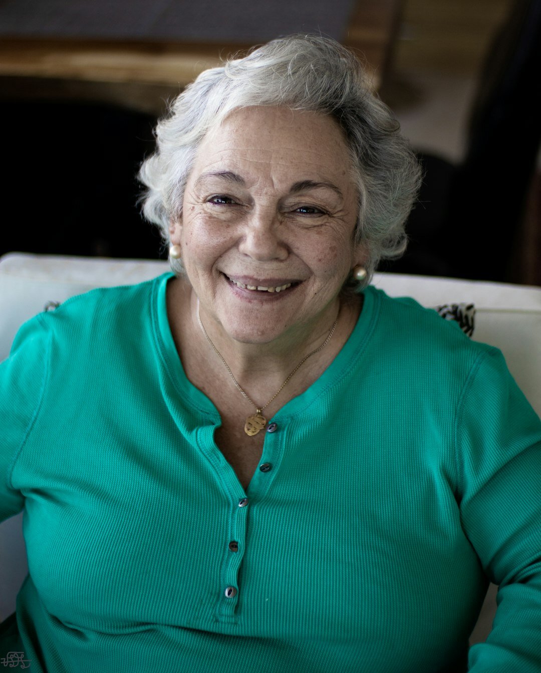 Portrait of a warm smiling senior woman, founder of a community club